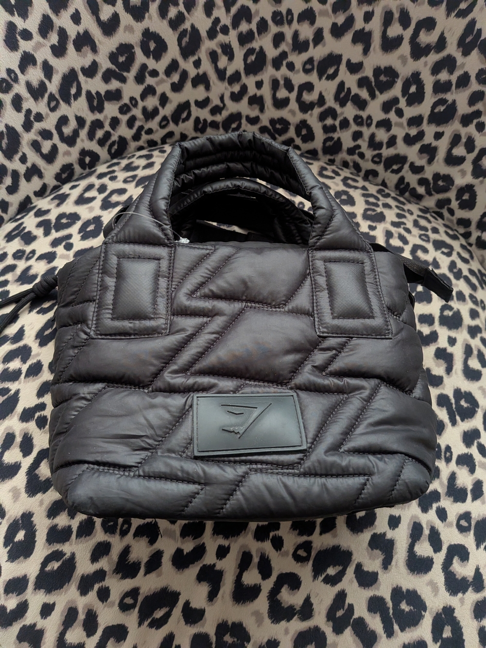 Gymshark Quilted Mini Tote in black featuring a distinctive geometric quilted